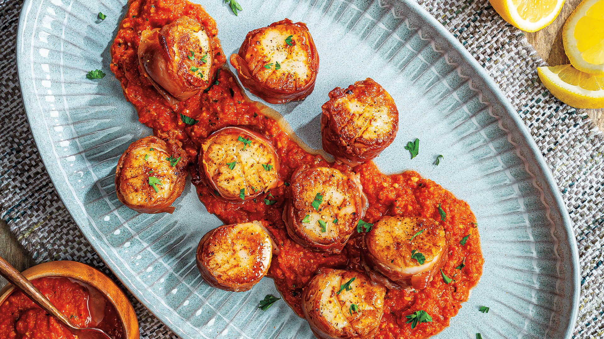 Seared ProsciuttoWrapped Scallops with Romesco Sauce Roche Bros