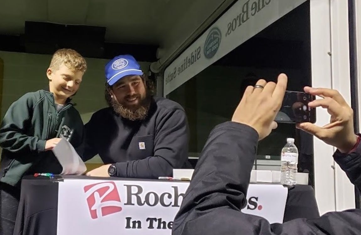 David Andrews pictured with boy at Sideline Suite