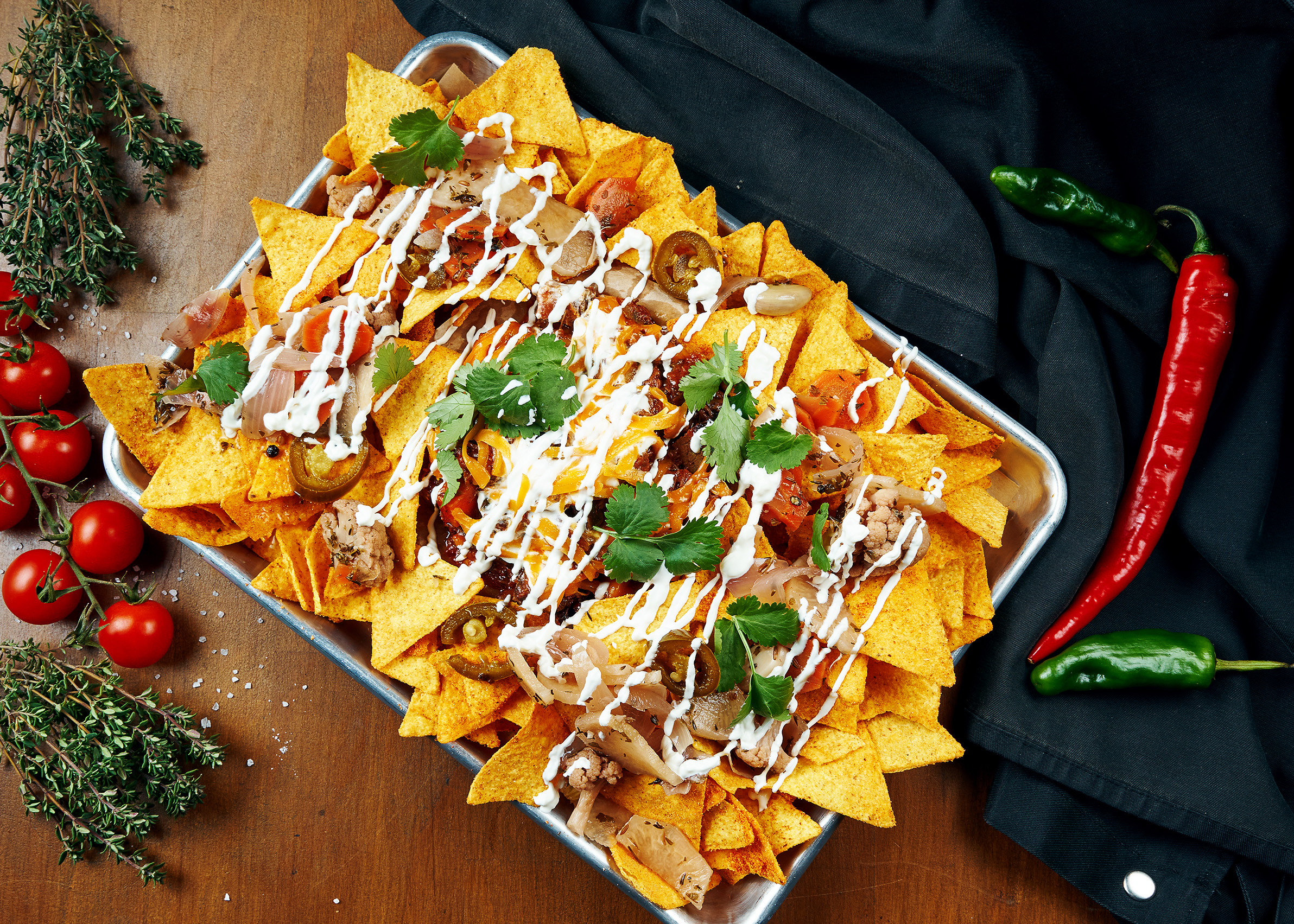 Nachos A Classic Mexican Appetizer Made From Corn Tortilla Chips. Nachos With Sauces And Holopenya. Top View. Close Up.