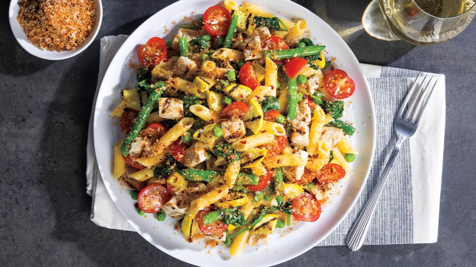 Grilled Chicken Primavera Penne with Spicy Parmesan Breadcrumbs
